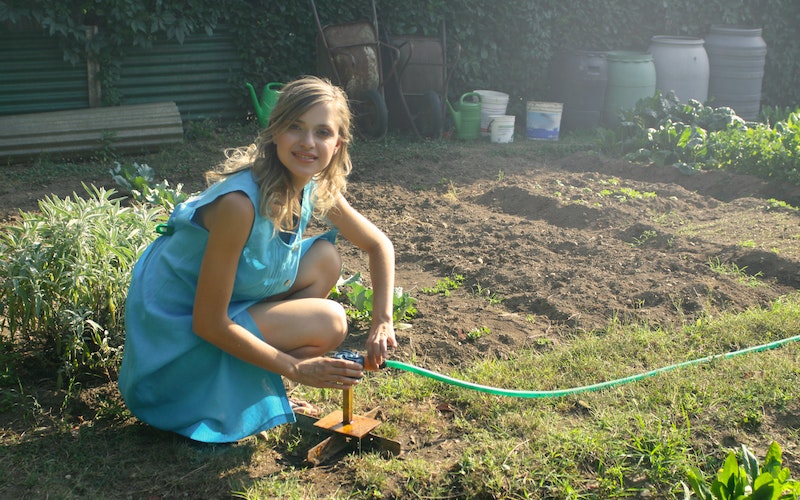 woman preparing the garden for square foot gardening